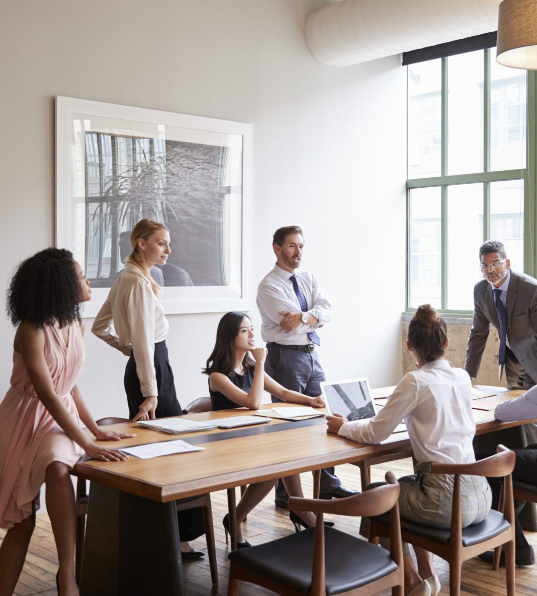 Young professionals around a table at a business meeting